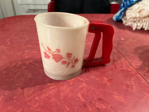 Vintage red plastic flour sifter