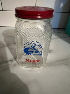 Vintage red Dutch sugar shaker
