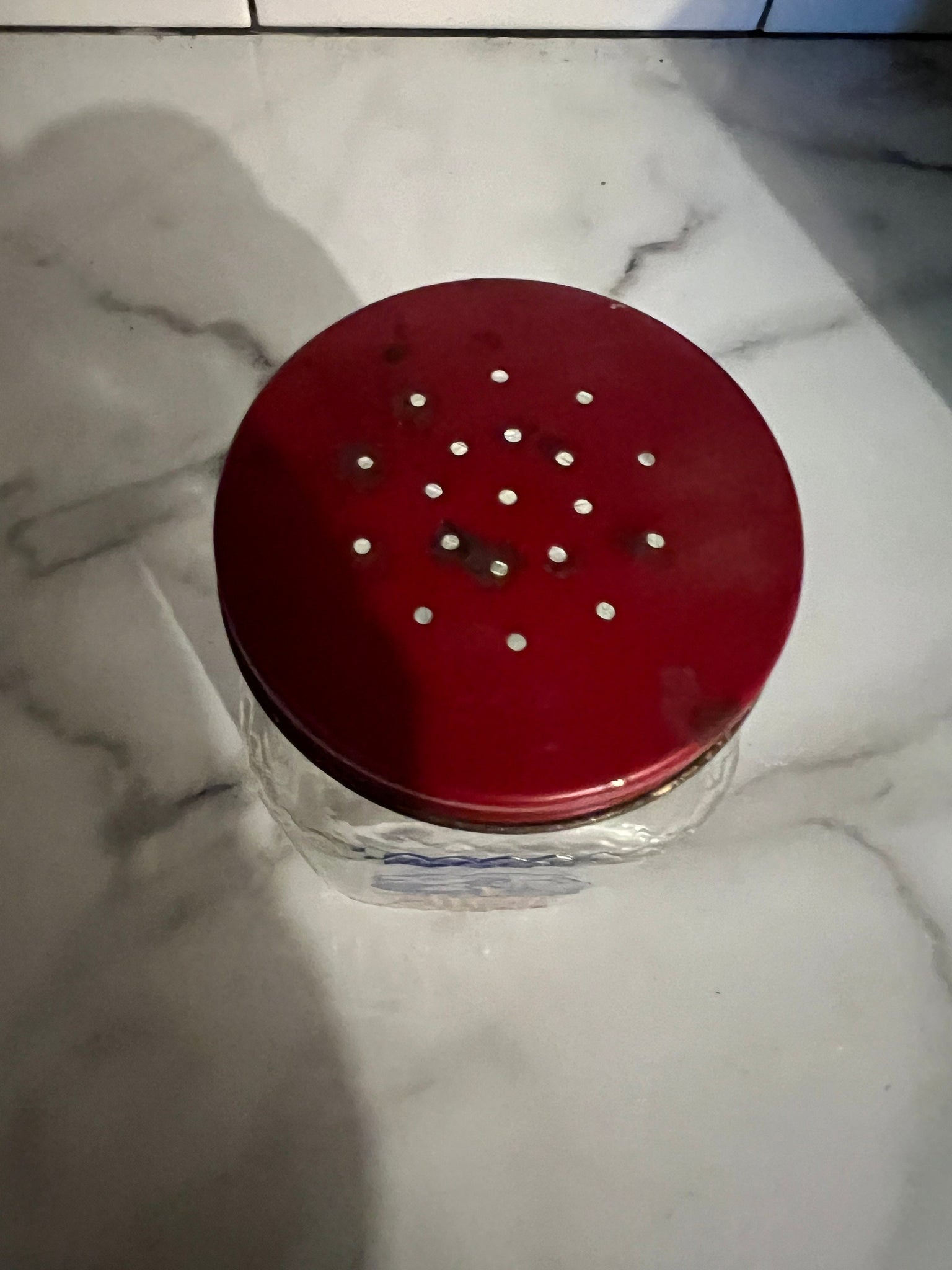 Vintage red Dutch sugar shaker